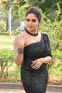 actress Karunya Chowdary sexy photo shoot in a black dress