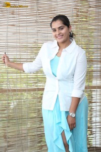 Indian Actress Kavya Kalyanram in a white shirt and blue skirt
