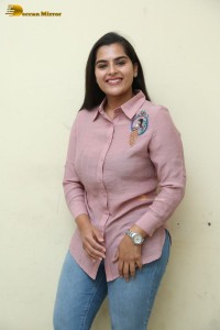 Tollywood Actress Kavya Kalyanram in a pink shirt and blue jeans