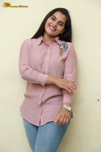 Tollywood Actress Kavya Kalyanram in a pink shirt and blue jeans