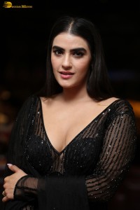 actress Kavya Thapar beautiful in a low neck black dress