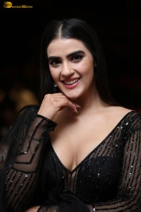 actress Kavya Thapar beautiful in a low neck black dress