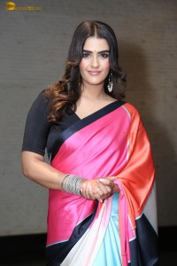 actress Kavya Thapar in a black and pink saree