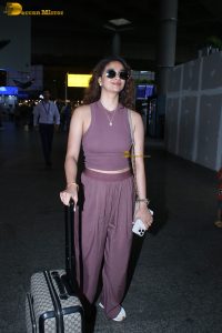 actress Keerthy Suresh in a stylish brown dress at mumbai airport