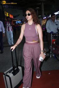 actress Keerthy Suresh in a stylish brown dress at mumbai airport