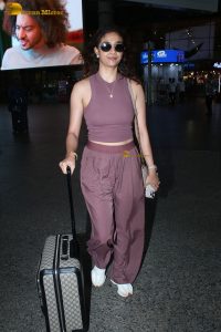 actress Keerthy Suresh in a stylish brown dress at mumbai airport