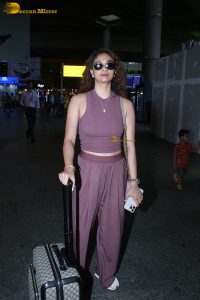 actress Keerthy Suresh in a stylish brown dress at mumbai airport