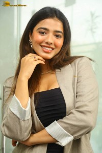 actress ketika sharma hot photoshoot in a grey coat over a shoulderless black dress