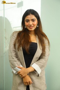 actress ketika sharma hot photoshoot in a grey coat over a shoulderless black dress