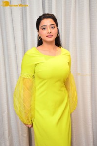 Actress Ketika Sharma pretty in a green dress