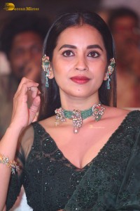 Telugu Actress Komalee Prasad in a green saree attending HIT 2 pre-release function