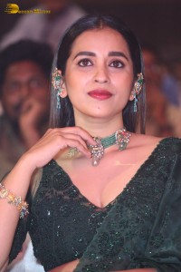 Telugu Actress Komalee Prasad in a green saree attending HIT 2 pre-release function