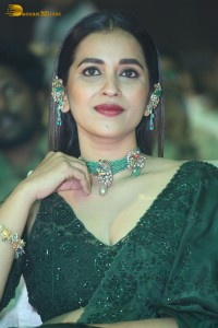 Telugu Actress Komalee Prasad in a green saree attending HIT 2 pre-release function