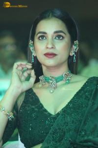Telugu Actress Komalee Prasad in a green saree attending HIT 2 pre-release function
