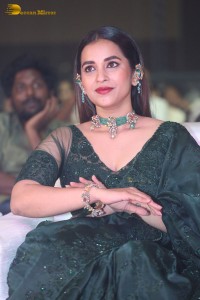 Telugu Actress Komalee Prasad in a green saree attending HIT 2 pre-release function