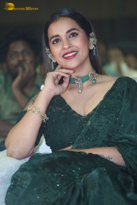 Telugu Actress Komalee Prasad in a green saree attending HIT 2 pre-release function