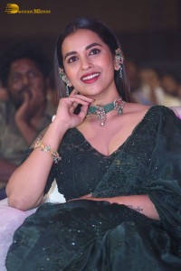 Telugu Actress Komalee Prasad in a green saree attending HIT 2 pre-release function