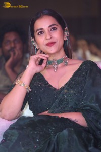 Telugu Actress Komalee Prasad in a green saree attending HIT 2 pre-release function