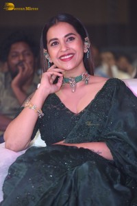 Telugu Actress Komalee Prasad in a green saree attending HIT 2 pre-release function