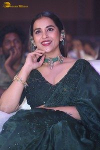 Telugu Actress Komalee Prasad in a green saree attending HIT 2 pre-release function