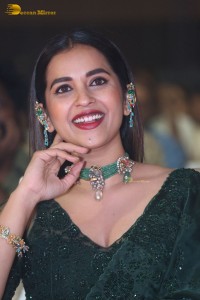 Telugu Actress Komalee Prasad in a green saree attending HIT 2 pre-release function