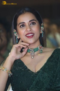 Telugu Actress Komalee Prasad in a green saree attending HIT 2 pre-release function