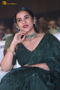 Telugu Actress Komalee Prasad in a green saree attending HIT 2 pre-release function