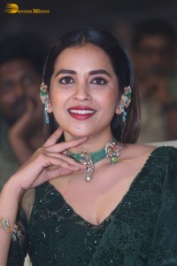 Telugu Actress Komalee Prasad in a green saree attending HIT 2 pre-release function