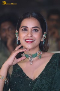 Telugu Actress Komalee Prasad in a green saree attending HIT 2 pre-release function