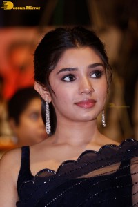 Actress Krithi Shetty in a black saree