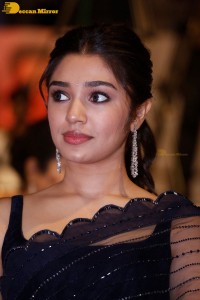 Actress Krithi Shetty in a black saree