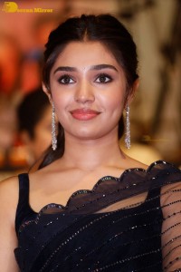 Actress Krithi Shetty in a black saree