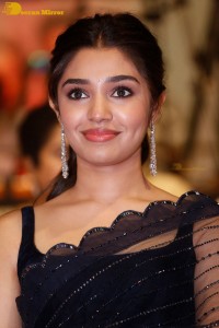 Actress Krithi Shetty in a black saree