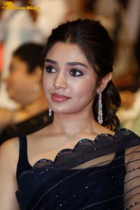 Actress Krithi Shetty in a black saree