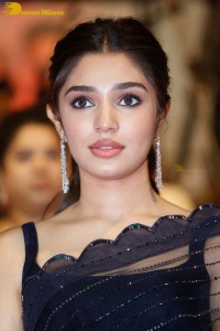 Actress Krithi Shetty in a black saree