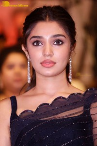 Actress Krithi Shetty in a black saree