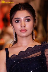 Actress Krithi Shetty in a black saree