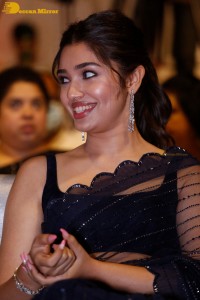 Actress Krithi Shetty in a black saree