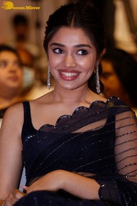 Actress Krithi Shetty in a black saree