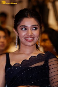 Actress Krithi Shetty in a black saree