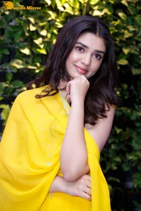 Actress Kirthi Shetty in a yellow salwar dress