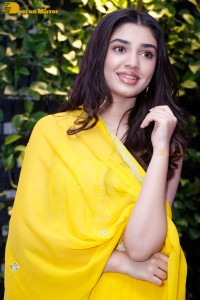 Actress Kirthi Shetty in a yellow salwar dress