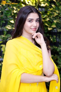 Actress Kirthi Shetty in a yellow salwar dress