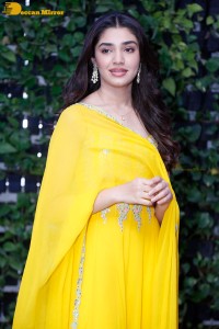 Actress Kirthi Shetty in a yellow salwar dress