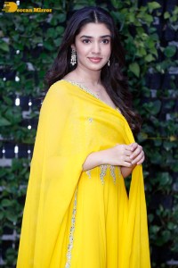Actress Kirthi Shetty in a yellow salwar dress