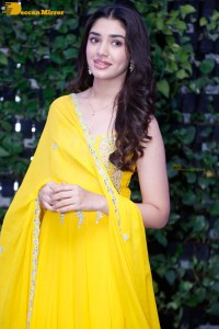 Actress Kirthi Shetty in a yellow salwar dress