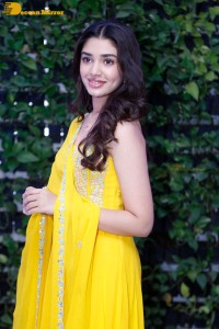 Actress Kirthi Shetty in a yellow salwar dress