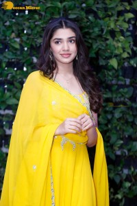 Actress Kirthi Shetty in a yellow salwar dress