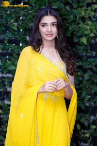 Actress Kirthi Shetty in a yellow salwar dress