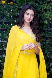 Actress Kirthi Shetty in a yellow salwar dress